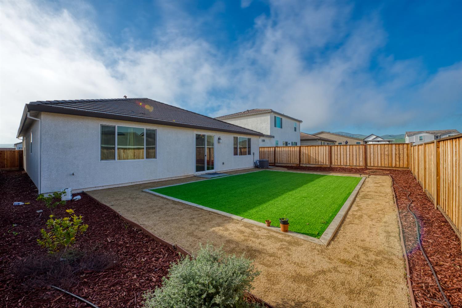 2209 Greenhorn Road Patterson, CA 95363 - Photo 25 of 32 a front view of a house with a garden and yard