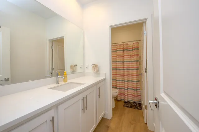 a bathroom with a sink a vanity and a mirror
