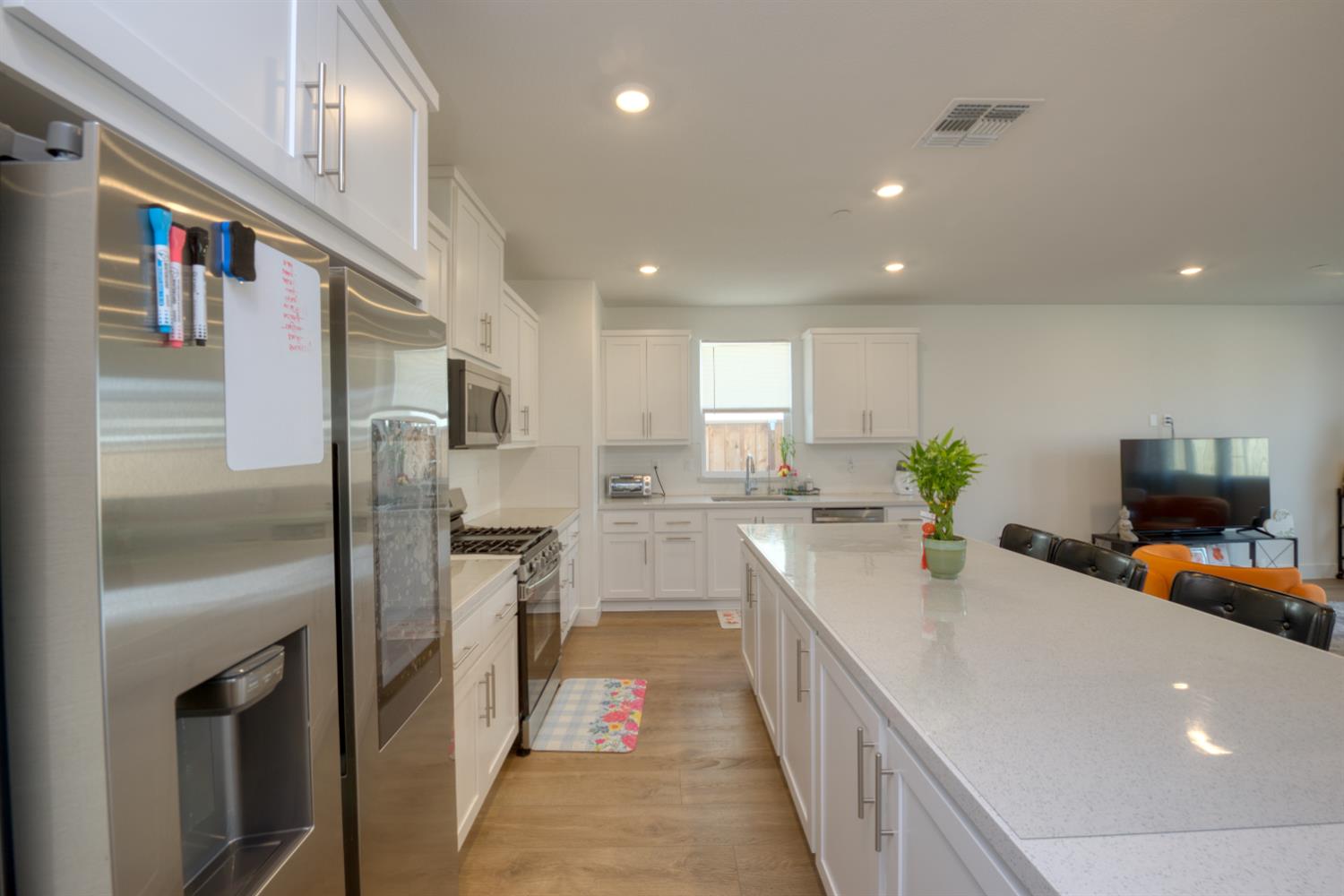2209 Greenhorn Road Patterson, CA 95363 - Photo 9 of 32 a kitchen with stainless steel appliances a refrigerator sink and stove