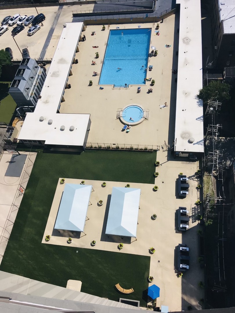 655 West Irving Park Road, Unit 2009 Chicago, IL 60613 - Photo 2 of 7 an aerial view of a house with pool and big yard