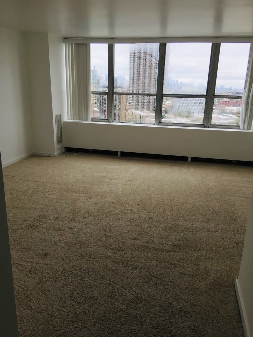655 West Irving Park Road, Unit 2009 Chicago, IL 60613 - Photo 6 of 7 a view of an empty room with a window