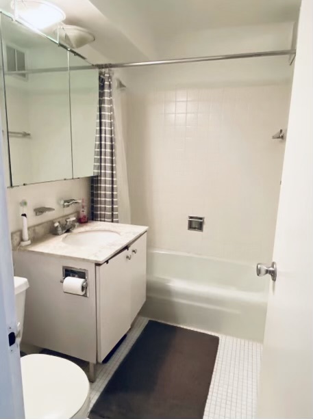 655 West Irving Park Road, Unit 2009 Chicago, IL 60613 - Photo 7 of 7 a bathroom with a sink a toilet and shower