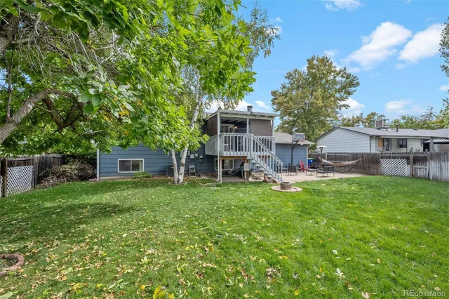 a view of a house with backyard porch and garden