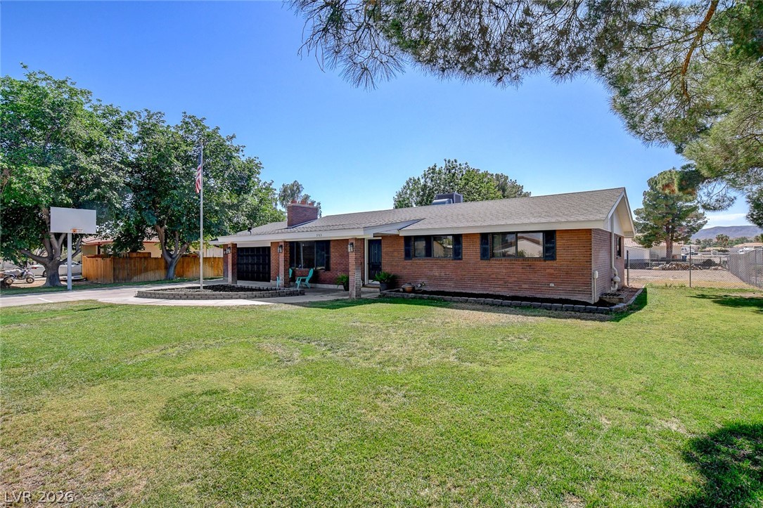3765 Berkeley Street Logandale, NV 89021 - Photo 12 of 87 This classic brick residence features a spacious front yard and a welcoming facade.