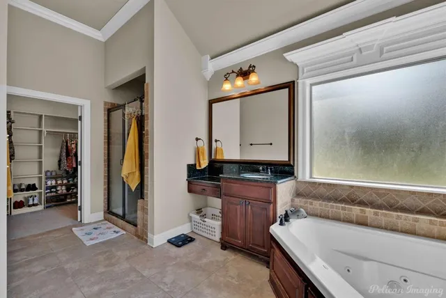 a living room with a couch and a dresser next to a window