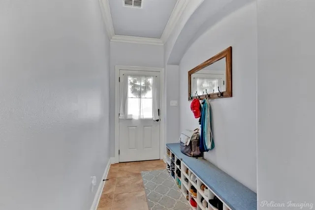 a room with cabinet and mirror