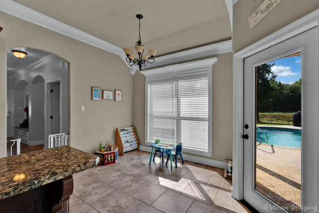 a view of a livingroom with furniture window and wooden floor