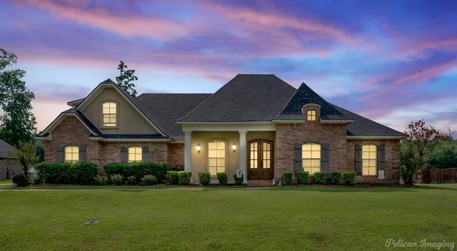 a kitchen with stainless steel appliances granite countertop a stove and cabinets