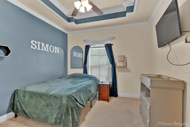 a bedroom with a bed a mirror and dresser