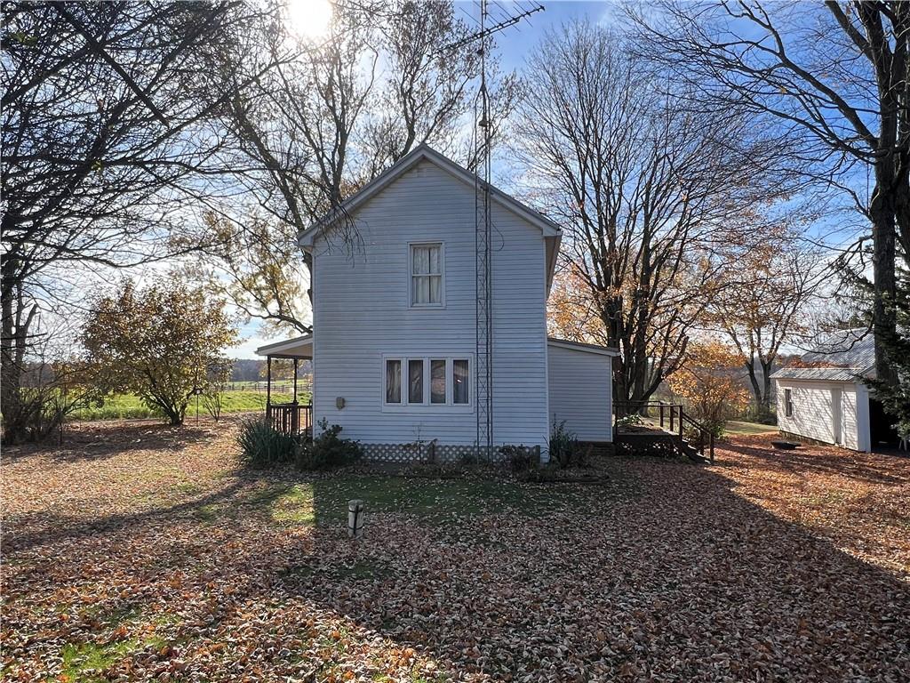 100 Long Road Harrisville, PA 16038 - Photo 3 of 12 a house that has a tree in front of it