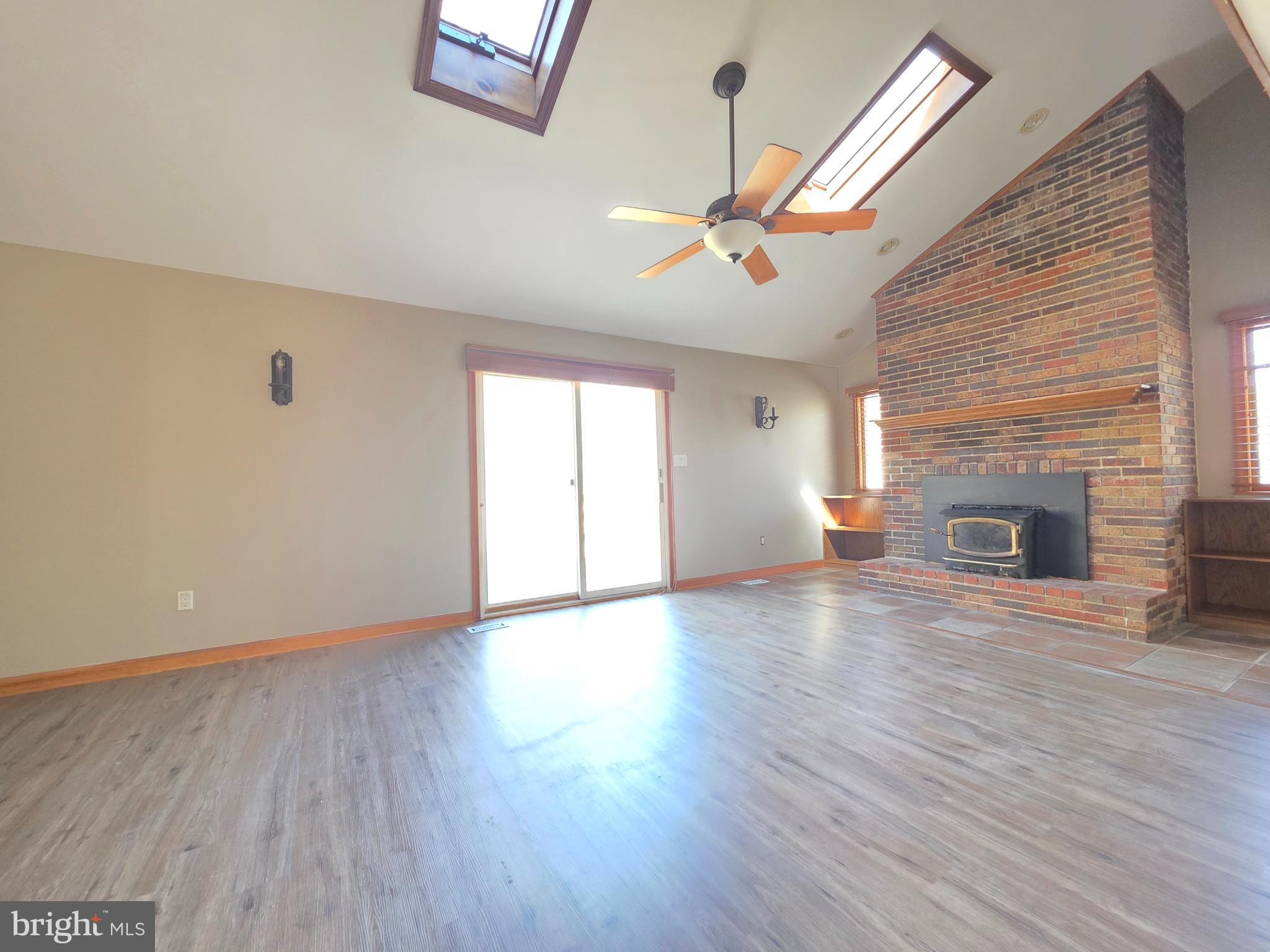 620 Columbia Road Egg Harbor City, NJ 08215 - Photo 12 of 53 a view of empty room with wooden floor and fan