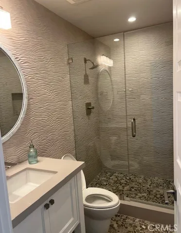 an empty room with wooden floor and closet