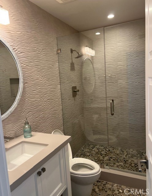 2929 Sandy Pointe, Unit 19 Del Mar, CA 92014 - Photo 15 of 17 a bathroom with a sink a toilet and shower