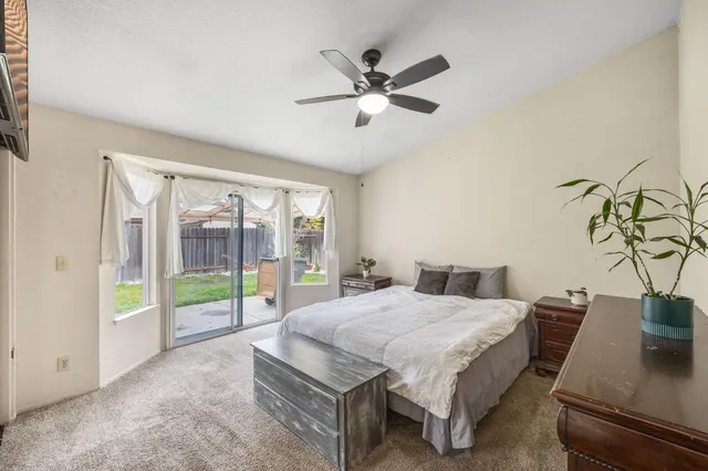 a bed sitting in a room next to a window