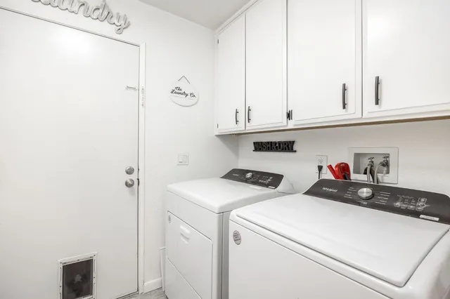 a utility room with dryer and washer