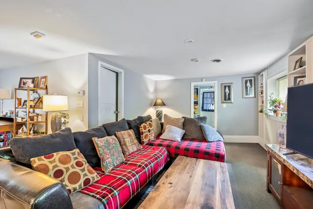 a view of a workspace with furniture and a potted plant