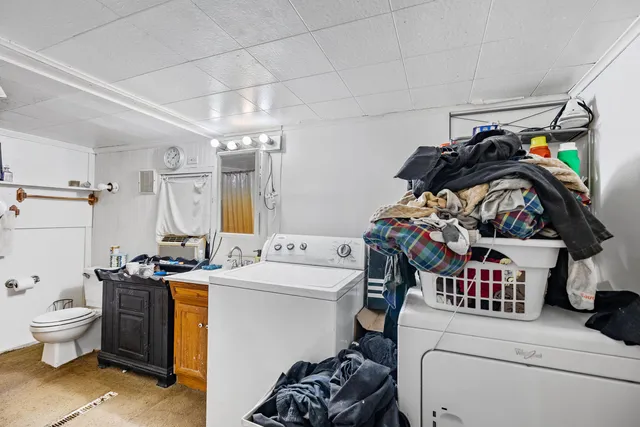 a bedroom with furniture and a flat screen tv