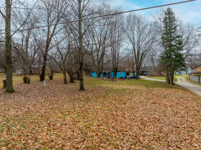 a view of a swimming pool with an outdoor space and seating area