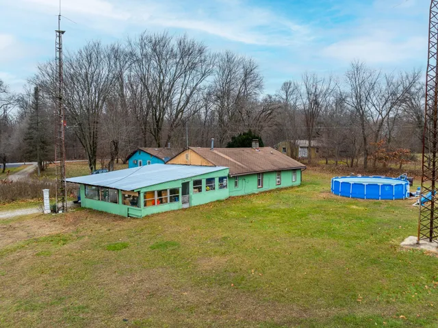 a yellow house with trees in front of it