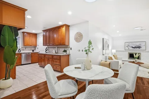 a view of kitchen with furniture and wooden floor