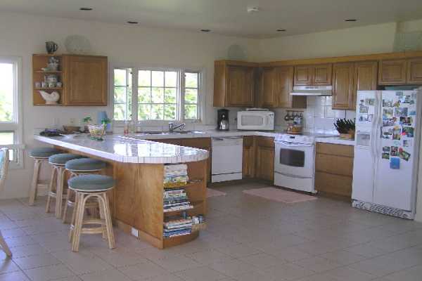 1534 Pe'e Road Koloa, HI 96756 - Photo 6 of 14 a kitchen with stainless steel appliances granite countertop a sink a stove a refrigerator cabinets and a window