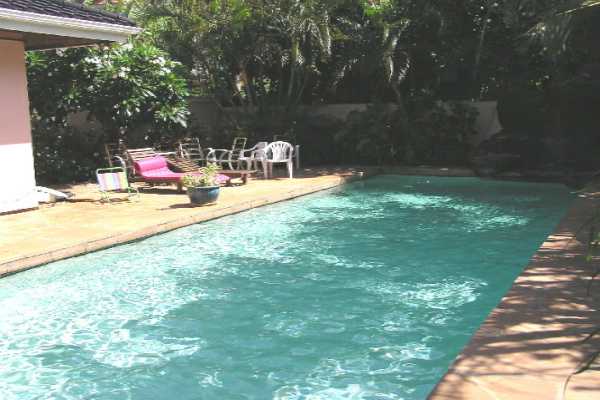 1534 Pe'e Road Koloa, HI 96756 - Photo 9 of 14 a backyard of a house with table and chairs