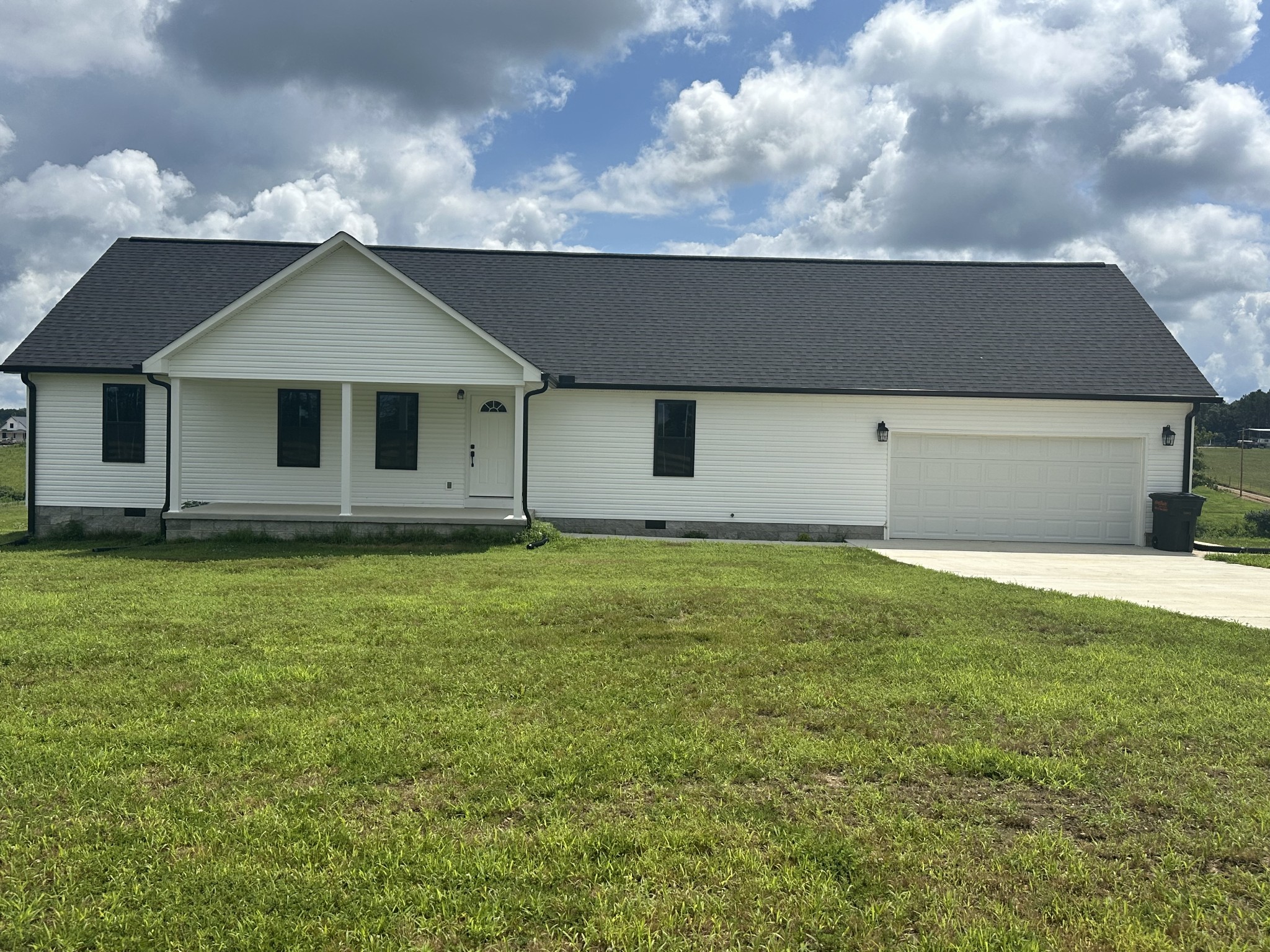 1654 Linville Road Lawrenceburg, TN 38464 - Photo 2 of 33 a front view of a house with a garden