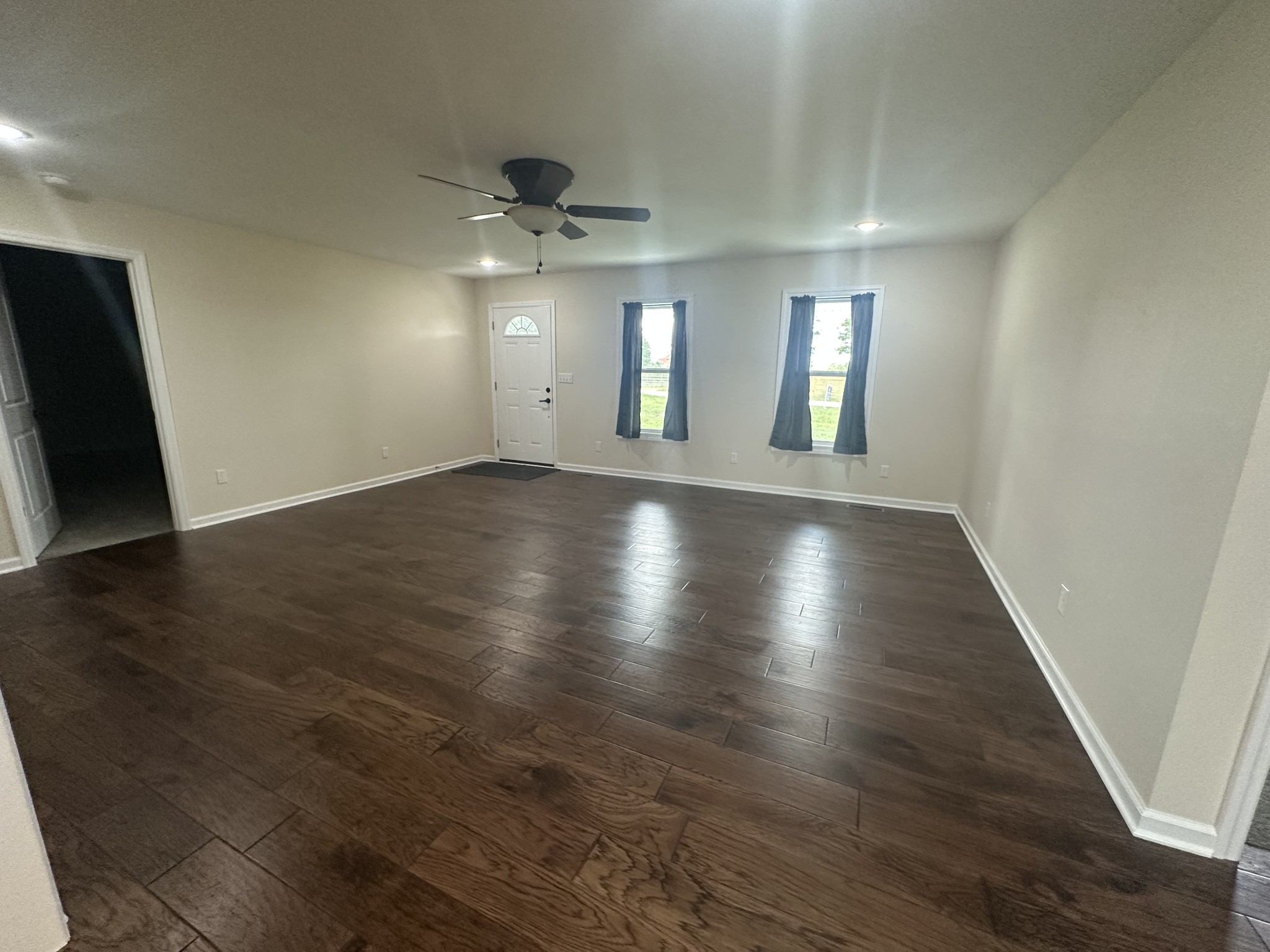 1654 Linville Road Lawrenceburg, TN 38464 - Photo 26 of 33 an empty room with wooden floor and windows