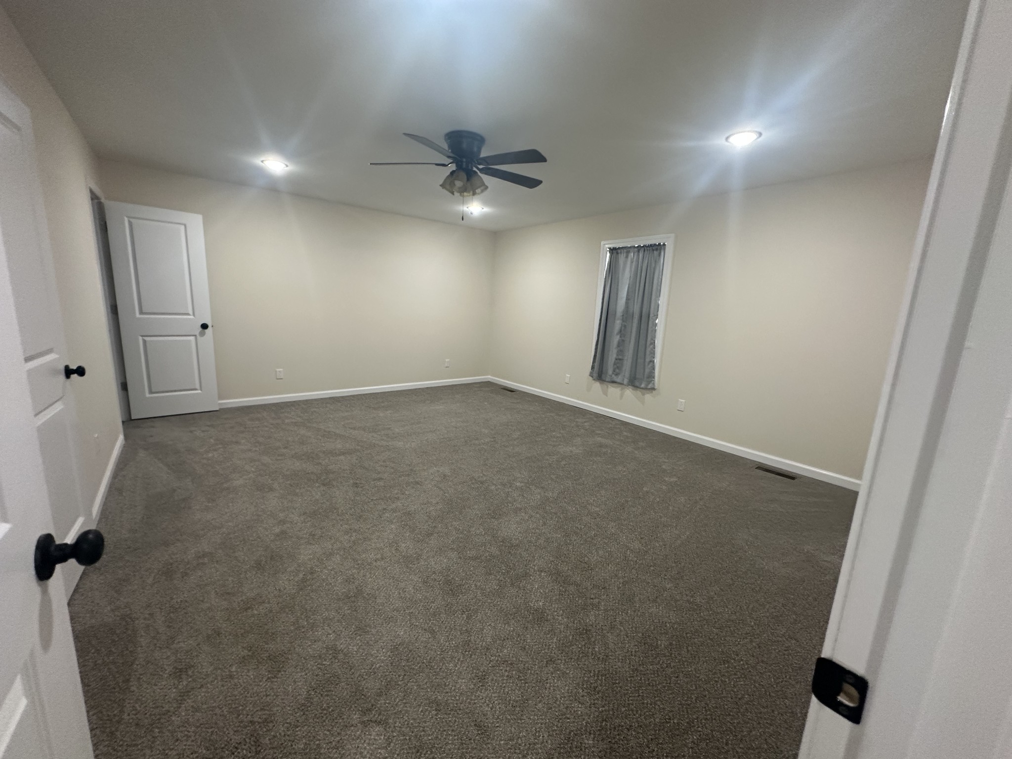 1654 Linville Road Lawrenceburg, TN 38464 - Photo 27 of 33 an empty room with windows and fan