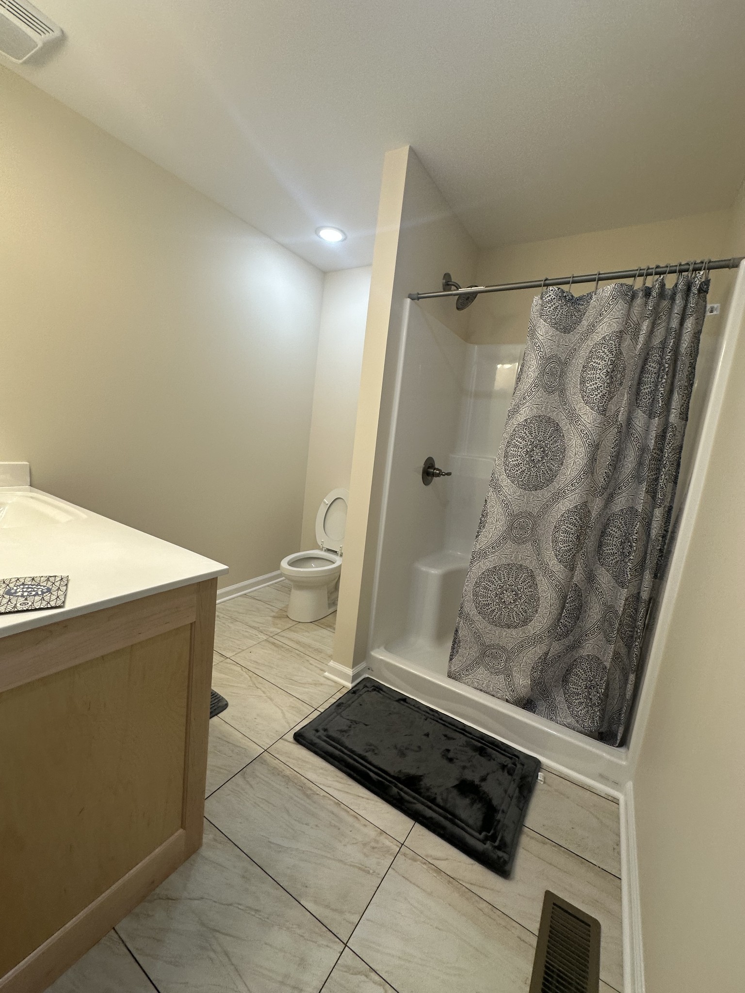 1654 Linville Road Lawrenceburg, TN 38464 - Photo 30 of 33 a bathroom with a granite countertop shower and a sink