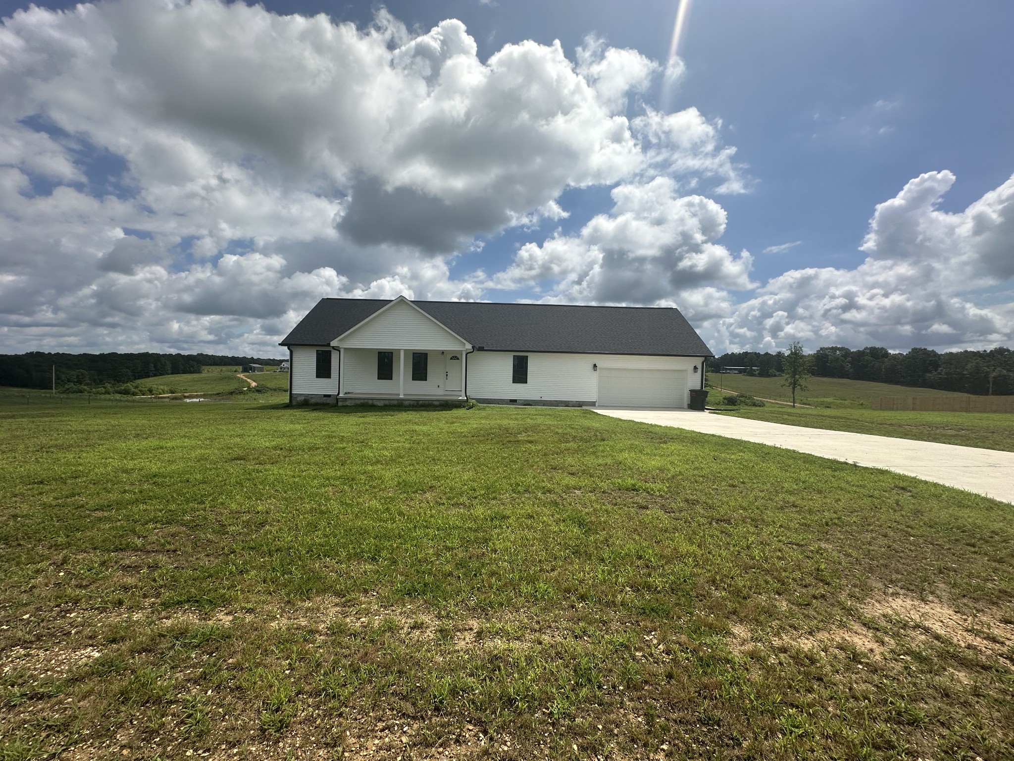 1654 Linville Road Lawrenceburg, TN 38464 - Photo 3 of 33 a view of a house with a yard