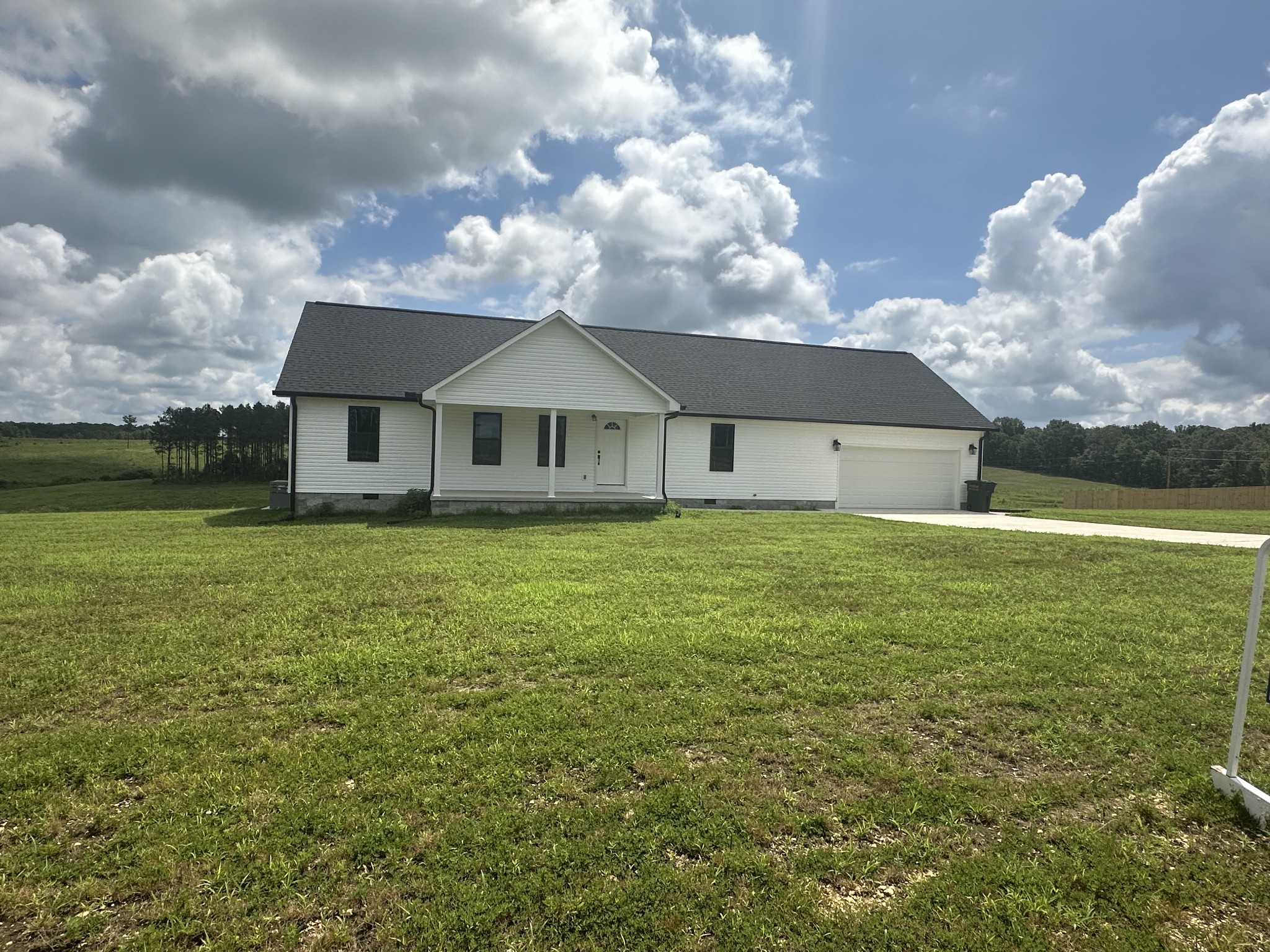 1654 Linville Road Lawrenceburg, TN 38464 - Photo 4 of 33 a front view of a house with a garden