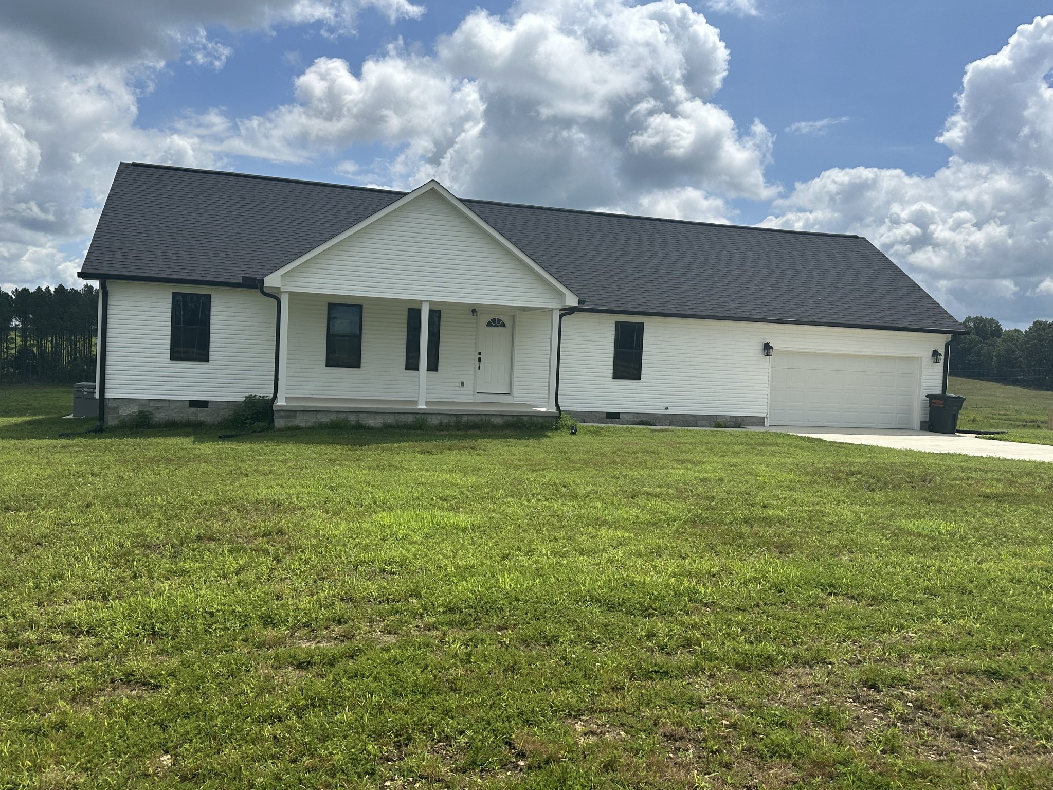 1654 Linville Road Lawrenceburg, TN 38464 - Photo 5 of 33 a front view of a house with a yard