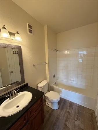 a view of gallery with wooden floor