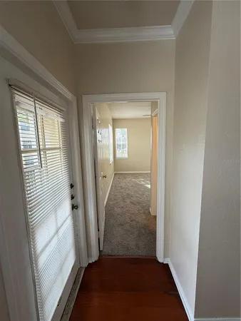 a view of an empty room with a window