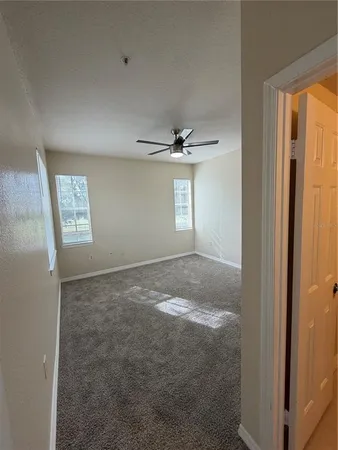 a view of an empty room with a window