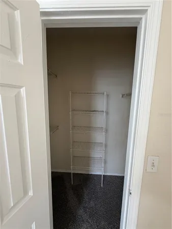 a bathroom with a sink vanity granite tub and a mirror
