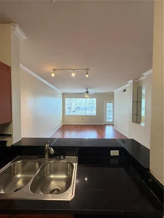 an view of a room with wooden floor