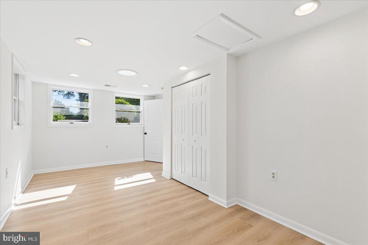 130 Brent Road Arnold, MD 21012 - Photo 24 of 46 an empty room with wooden floor and windows