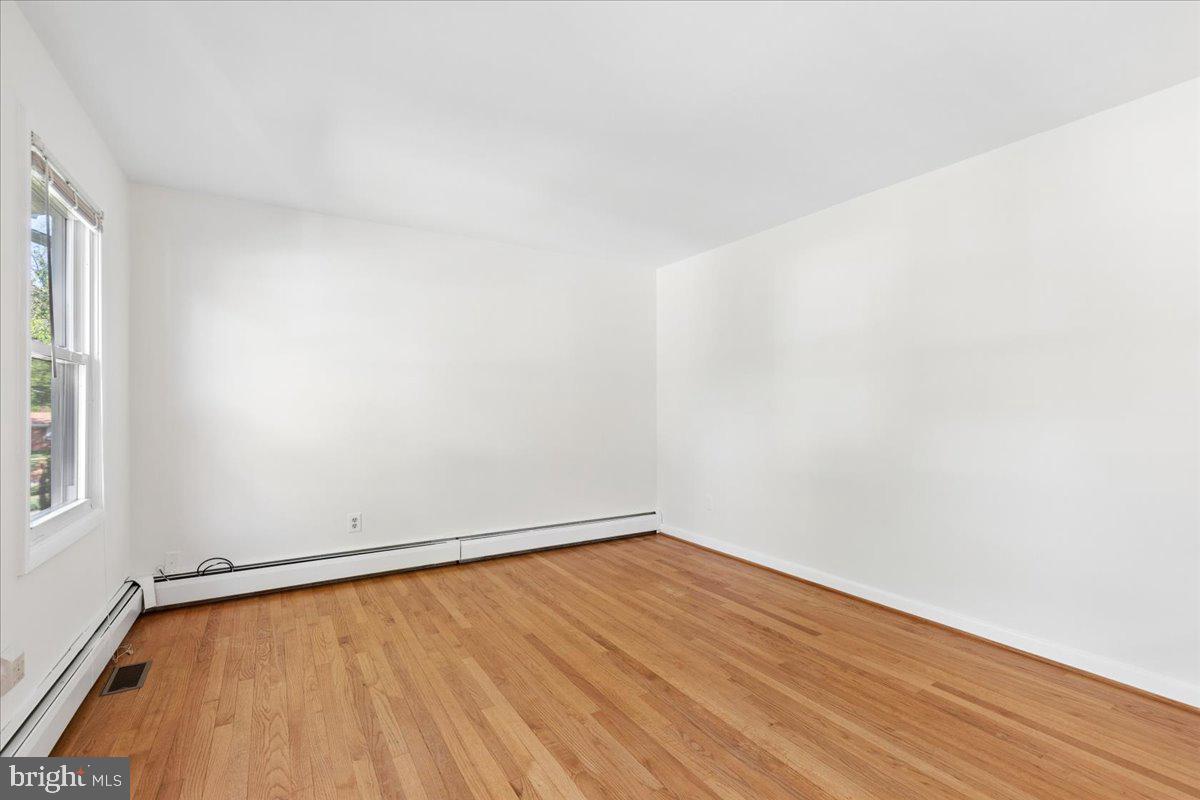 130 Brent Road Arnold, MD 21012 - Photo 30 of 46 a view of an empty room with wooden floor and a window