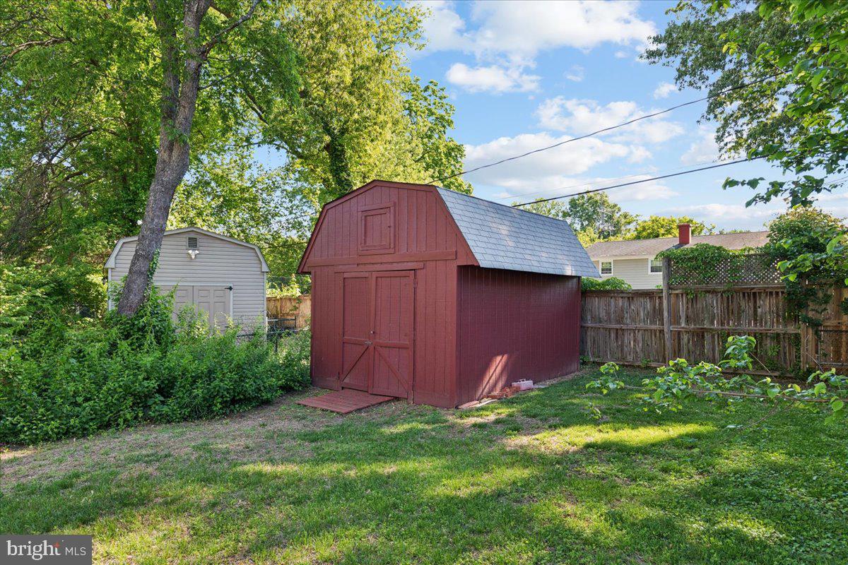 130 Brent Road Arnold, MD 21012 - Photo 7 of 46 a view of backyard with potted plants and wooden fence