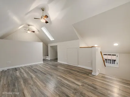 a view of a ceiling fan and entryway