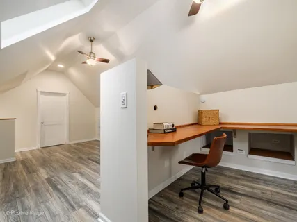 a view of workspace with wooden floor