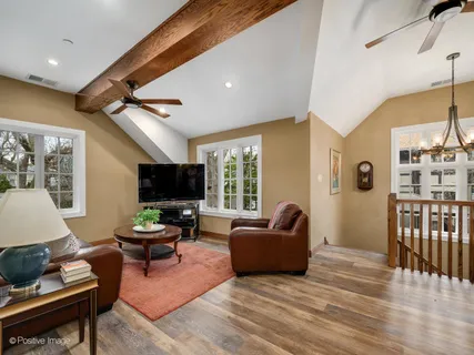 a living room with furniture fireplace and a flat screen tv