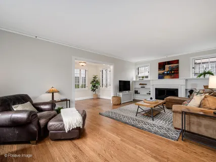 a living room with furniture fireplace and a flat screen tv
