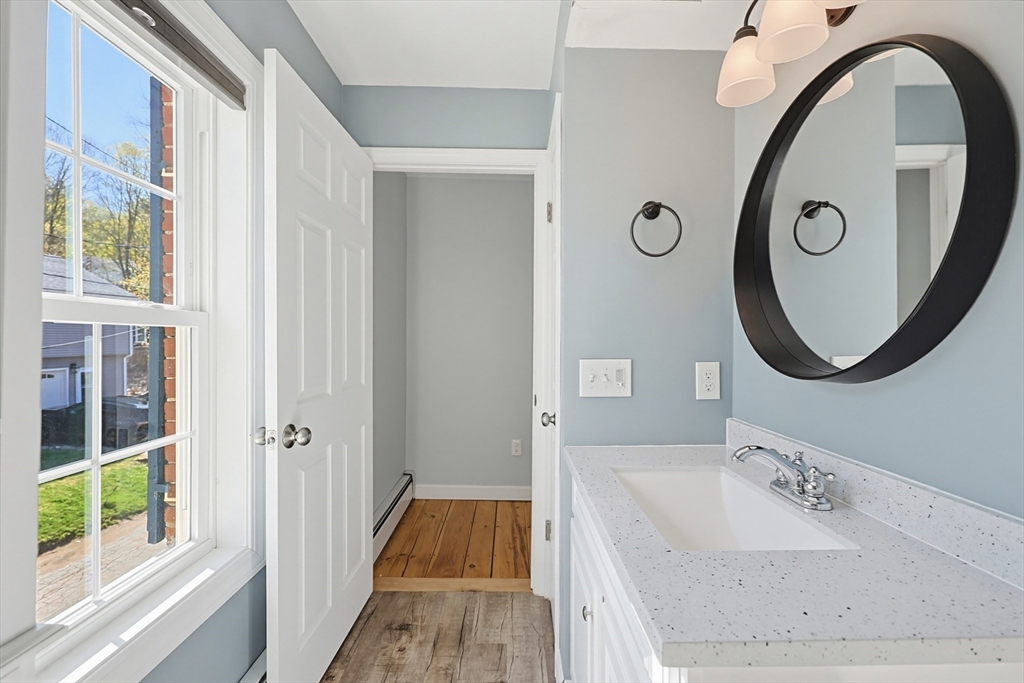 44 Clark Street Spencer, MA 01562 - Photo 17 of 41 a bathroom with a sink and a mirror