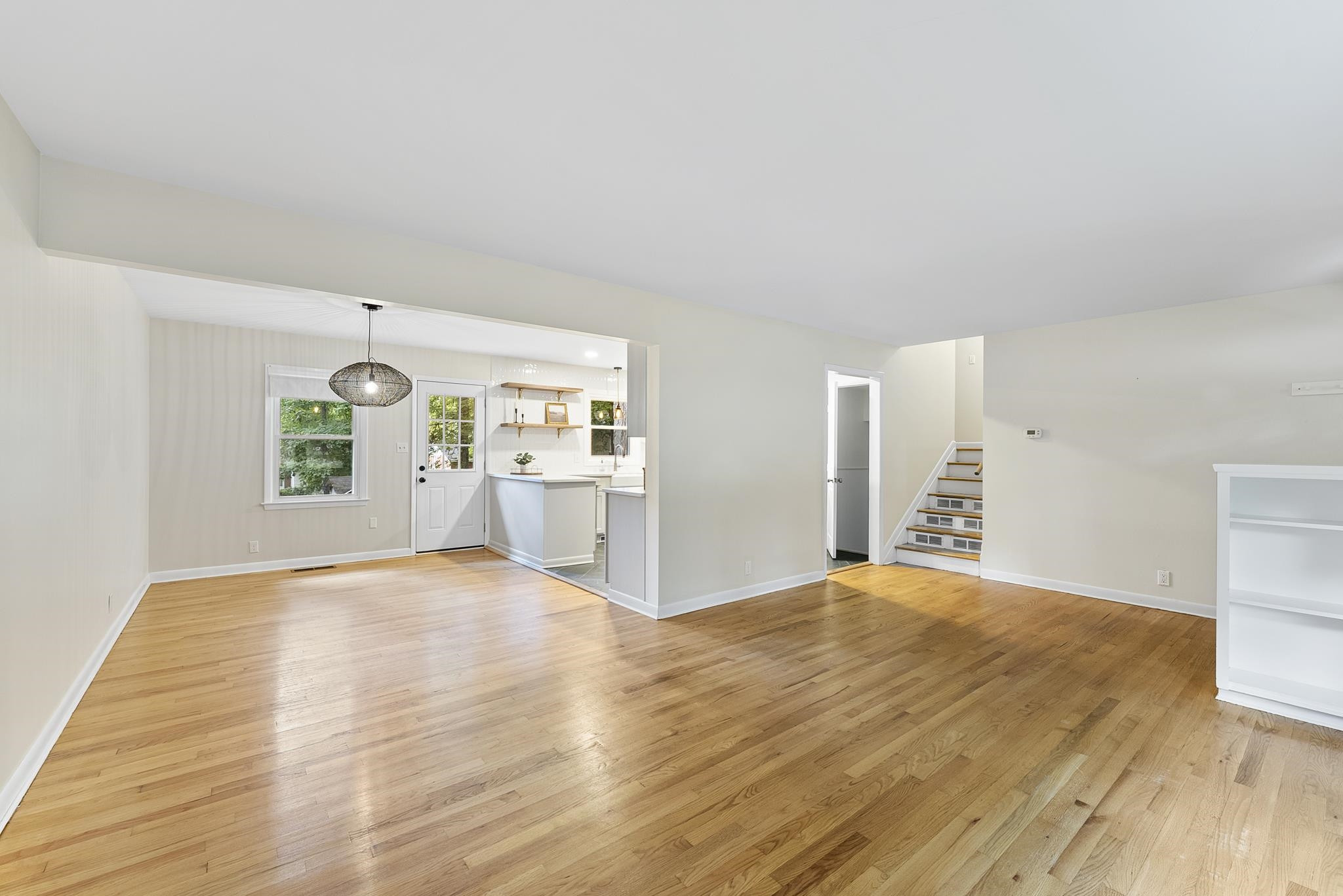 3308 Barker Place Raleigh, NC 27604 - Photo 7 of 21 a view of an empty room with window and wooden floor