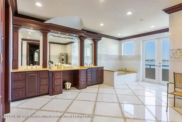 a large bathroom with a large tub and sink