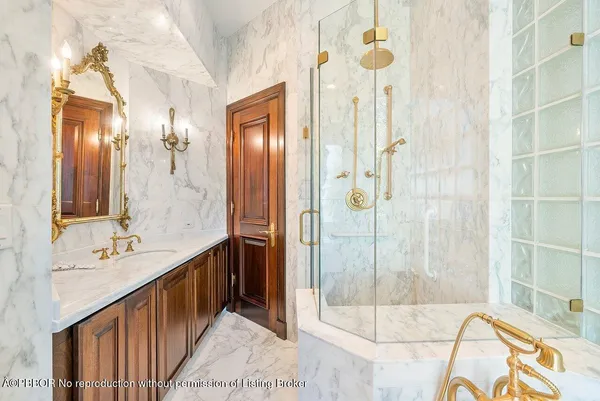 a bathroom with a double vanity sink mirror and shower