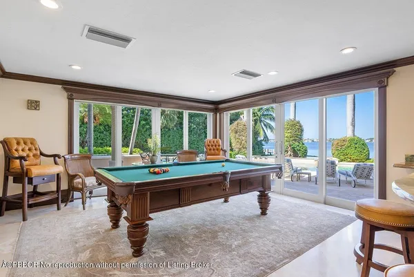 a room with furniture and large windows